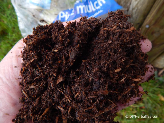 Close-up of pine mulch to be used in an herbal tea garden to retain moisture and prevent weeds. Close-up of pine mulch to be used in an herbal tea garden to retain moisture and prevent weeds.